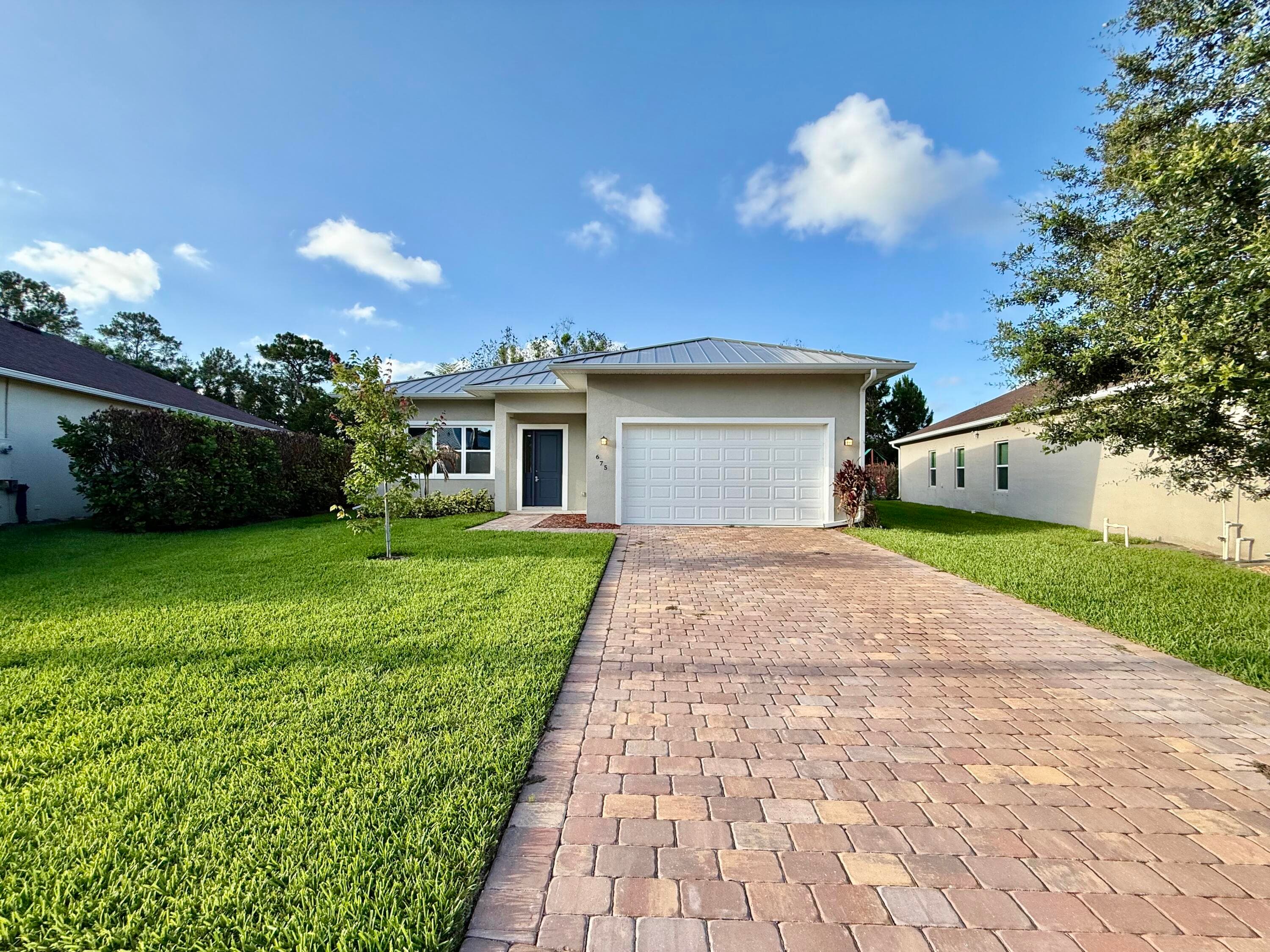 675 NE Moss Rose Place, Port St. Lucie, FL 34983